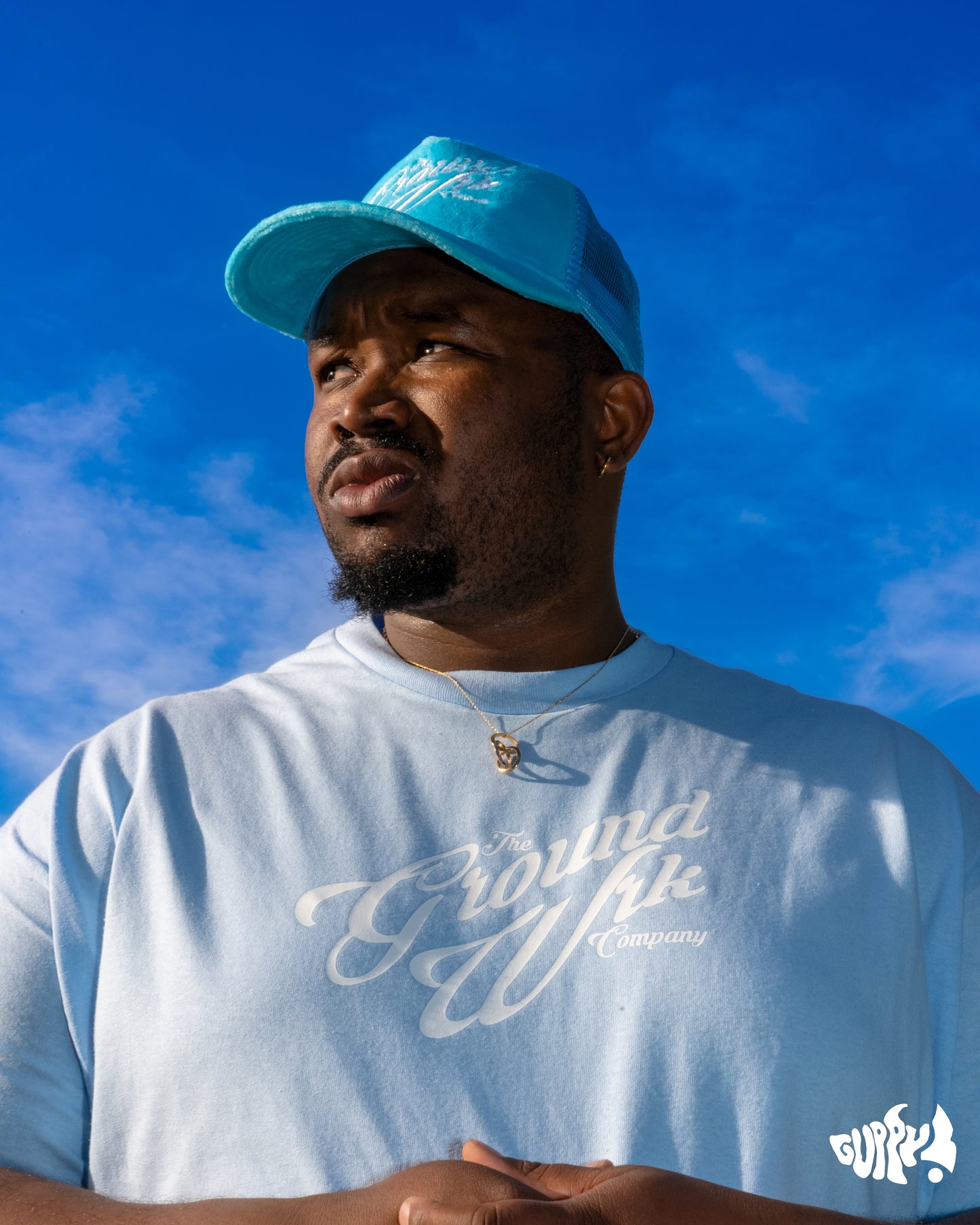 a man wearing a blue hat and a blue shirt