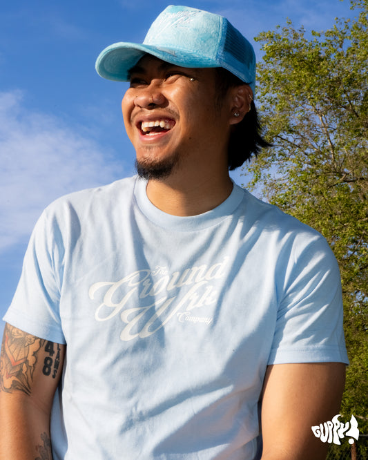 a man wearing a blue hat and a blue shirt